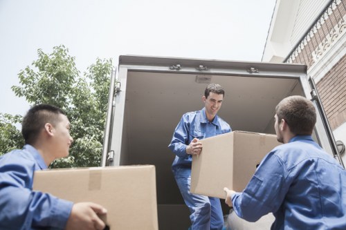 Office furniture and files being prepared for a local business move