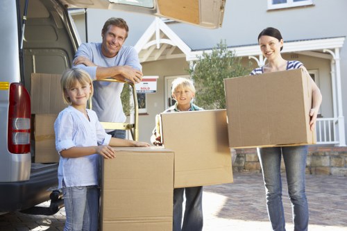 Professional removal van loading household furniture in East Barnet