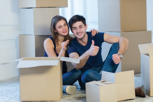 Local movers handling household items during a move in East Barnet