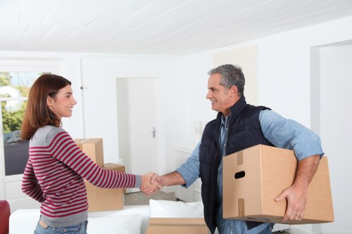 Local moving team handling furniture near Eastbarnet streets