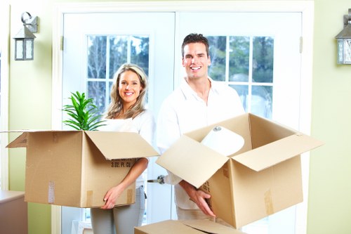 Commercial moving team handling office furniture
