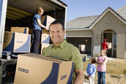 Packing and loading furniture into a moving truck for East Barnet customers